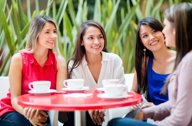 Group of women talking over a cup of coffee